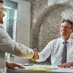 happy-manager-handshaking-with-candidate-after-successful-job-interview